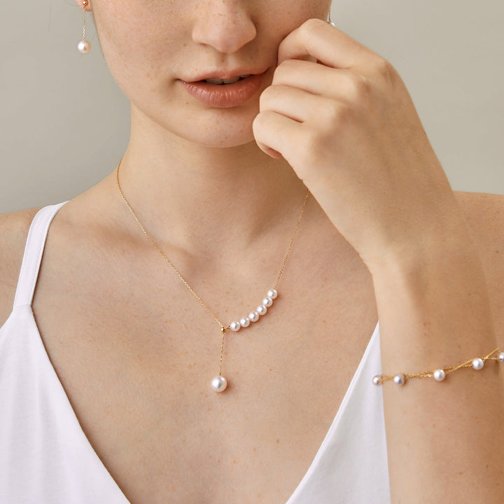 Asymmetrical Akoya pearl 18K gold necklace from Mermaid's Tear Collection featuring a unique floating pearl design.