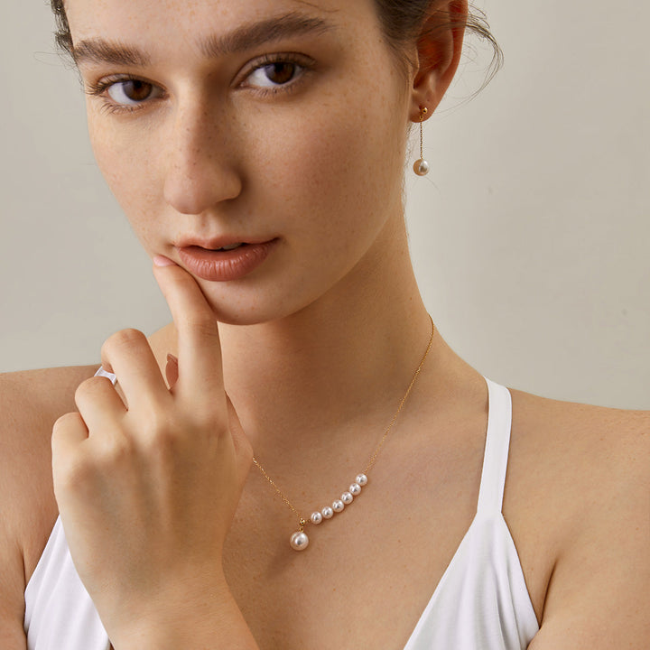 Asymmetrical Akoya pearl 18K gold necklace from Mermaid's Tear Collection featuring a unique design and lustrous pearls.