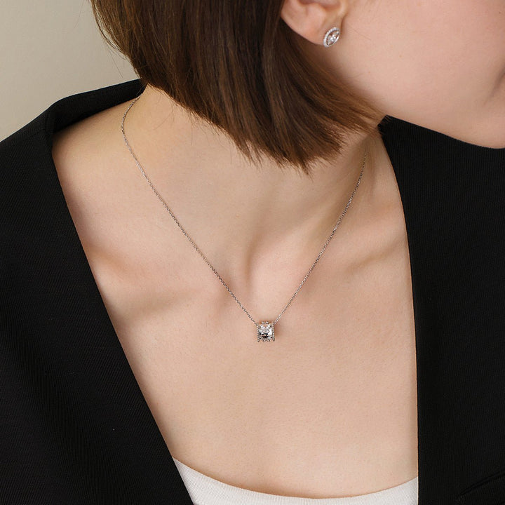 Model wearing lab-grown diamond butterfly pendant necklace styled with black blazer and matching earrings