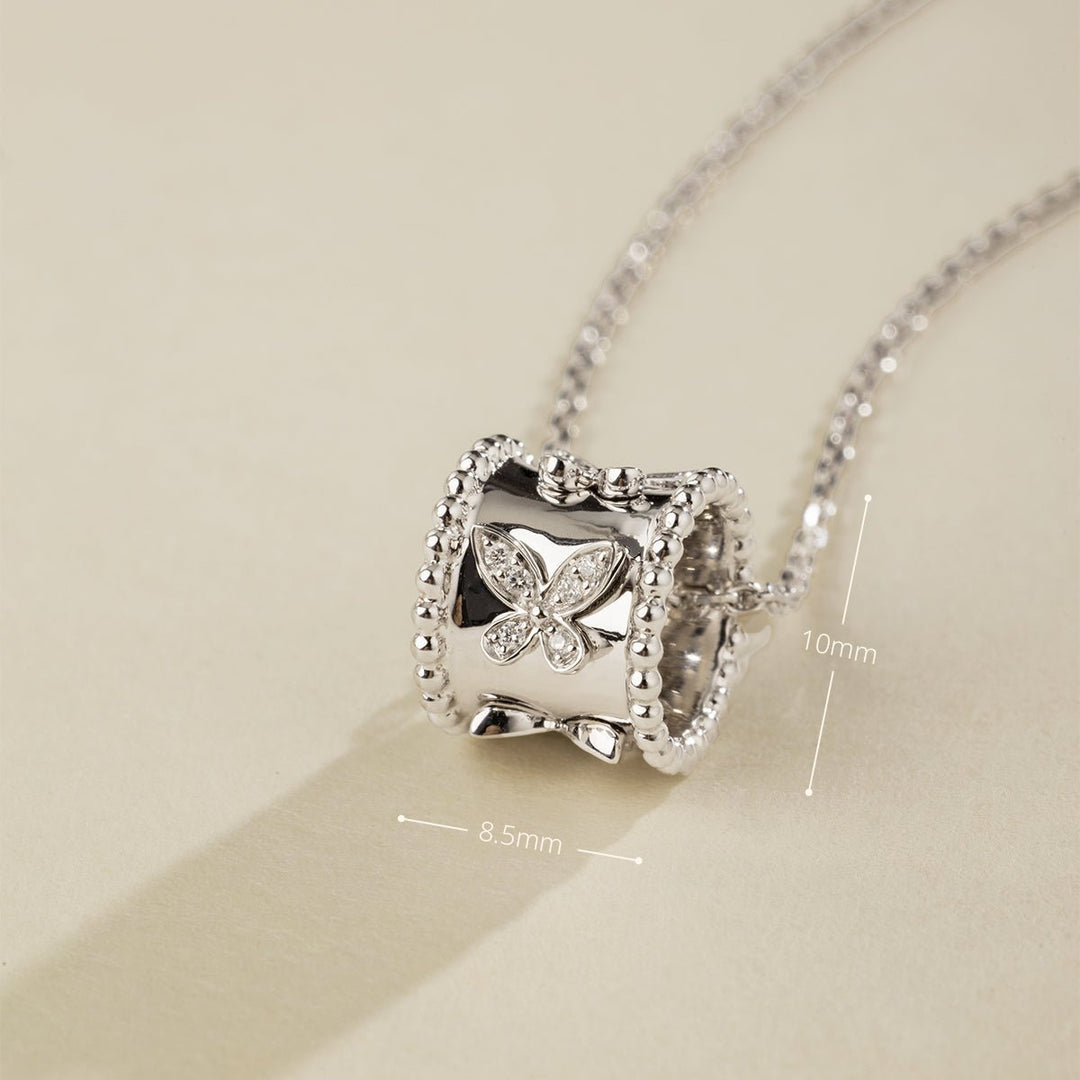 Close-up of lab-grown diamond kaleidoscope butterfly pendant, 8.5mm wide by 10mm tall, rhodium-plated sterling silver