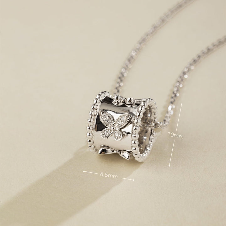 Close-up of lab-grown diamond kaleidoscope butterfly pendant, 8.5mm wide by 10mm tall, rhodium-plated sterling silver