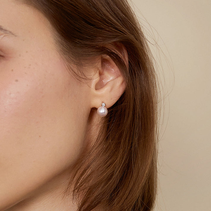 Possibility Collection Premier Akoya Pearl 18K gold diamond stud earrings featuring lustrous pearls and sparkling diamonds.