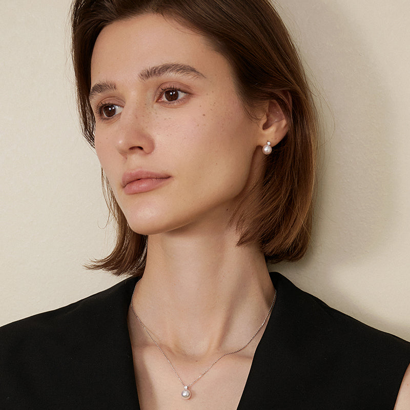 Possibility Collection Premier Akoya Pearl and diamond stud earrings with 18K gold settings, showcasing elegant jewelry design.