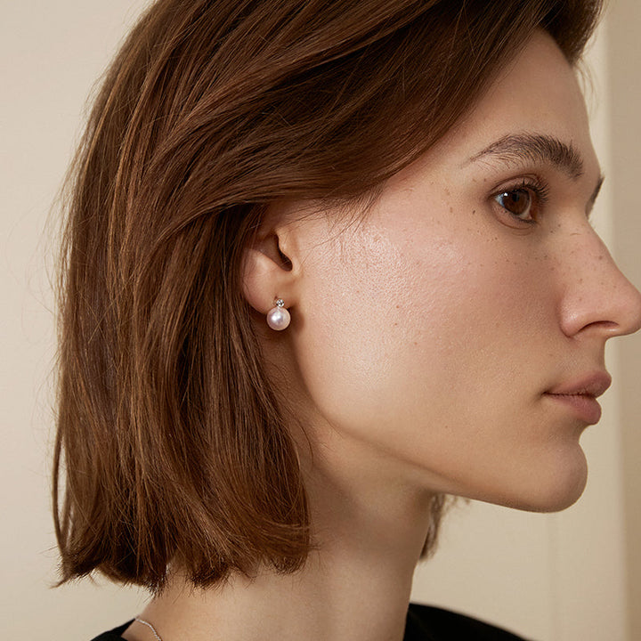 Possibility Collection Premier Akoya Pearl and diamond stud earrings in 18K gold, showcasing elegant pearl and sparkling diamonds.