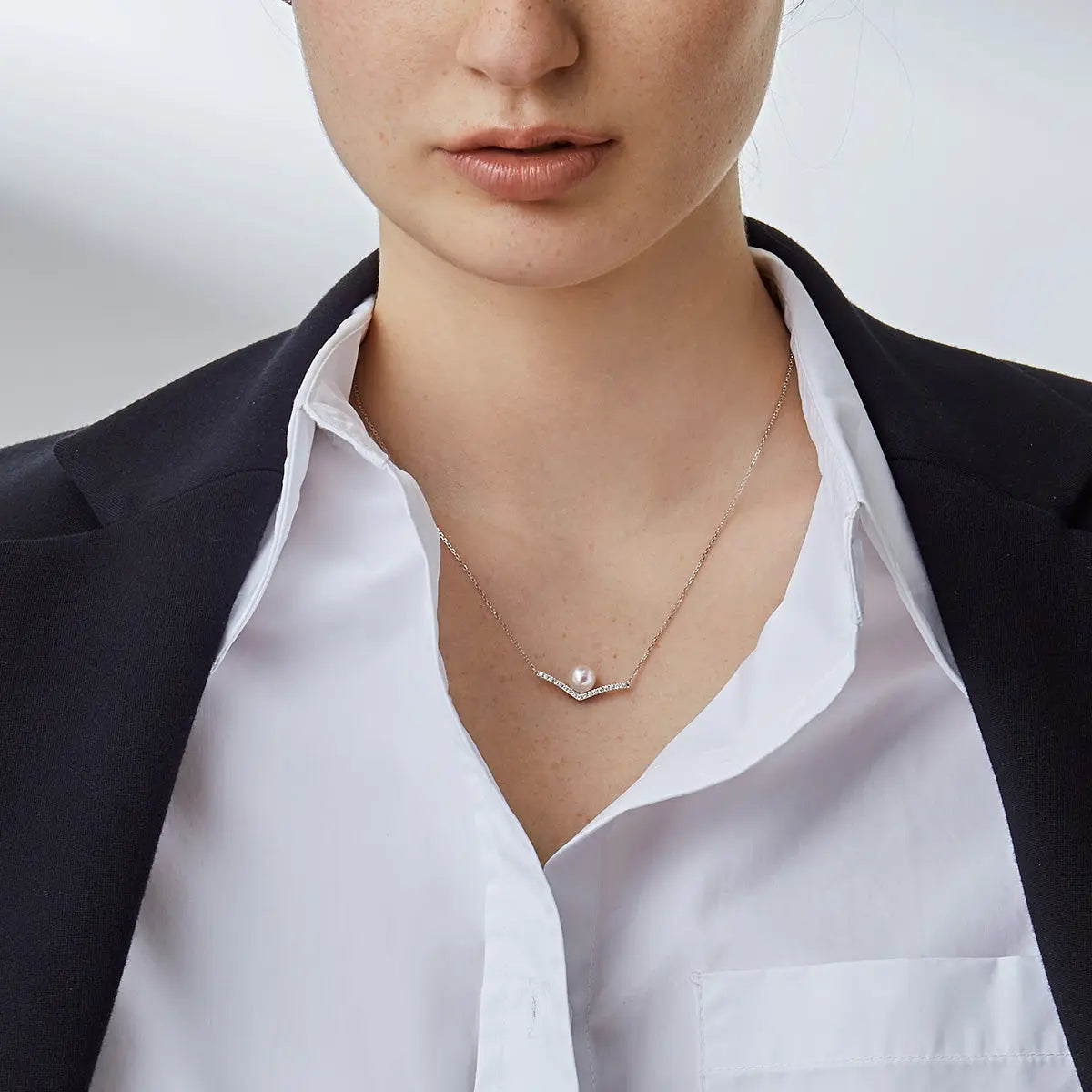 Akoya saltwater pearl 18K white gold diamond V-shape necklace from Reflection Collection, showcasing elegant pearl and sparkling diamonds.