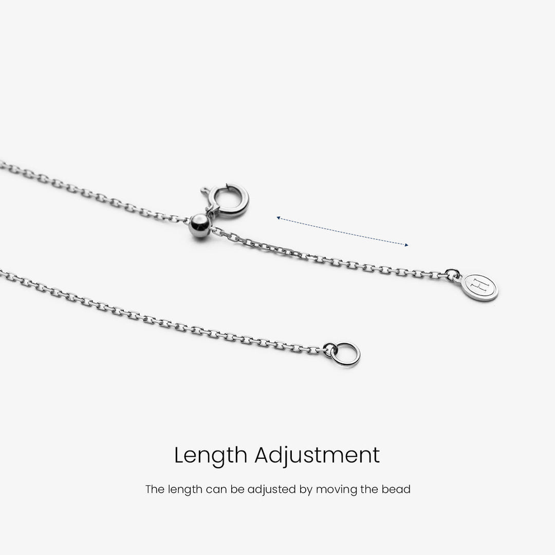 Akoya pearl and moon-shaped diamond necklace in 18K white gold from Reflection Collection, featuring elegant jewelry design.
