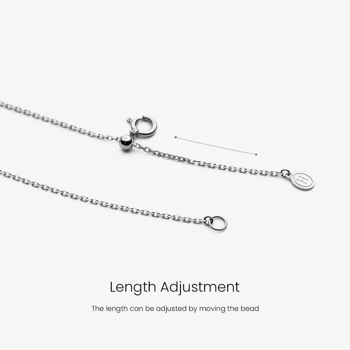 Akoya pearl and moon-shaped diamond necklace in 18K white gold from Reflection Collection, featuring elegant jewelry design.