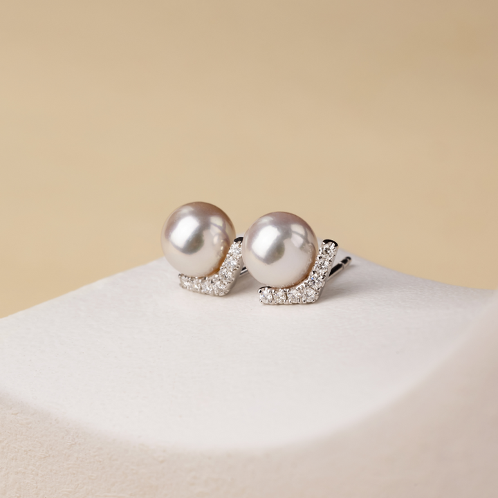 Akoya pearl and diamond stud earrings in 18K white gold V-shape design from Reflection Collection
