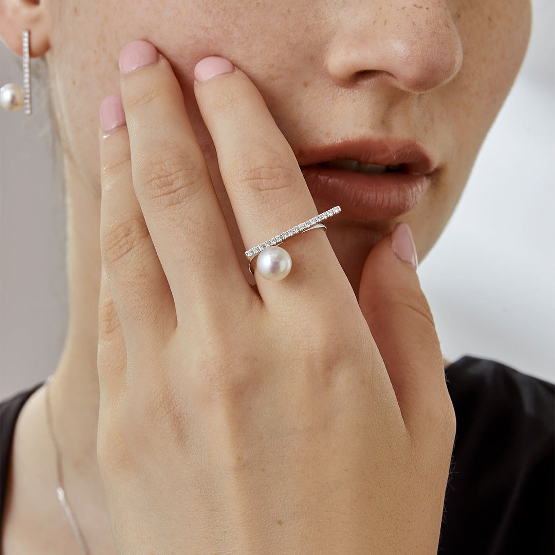 Akoya pearl 18K white gold moon-shaped diamond ring from Reflection Collection, showcasing a lustrous pearl and sparkling diamonds.
