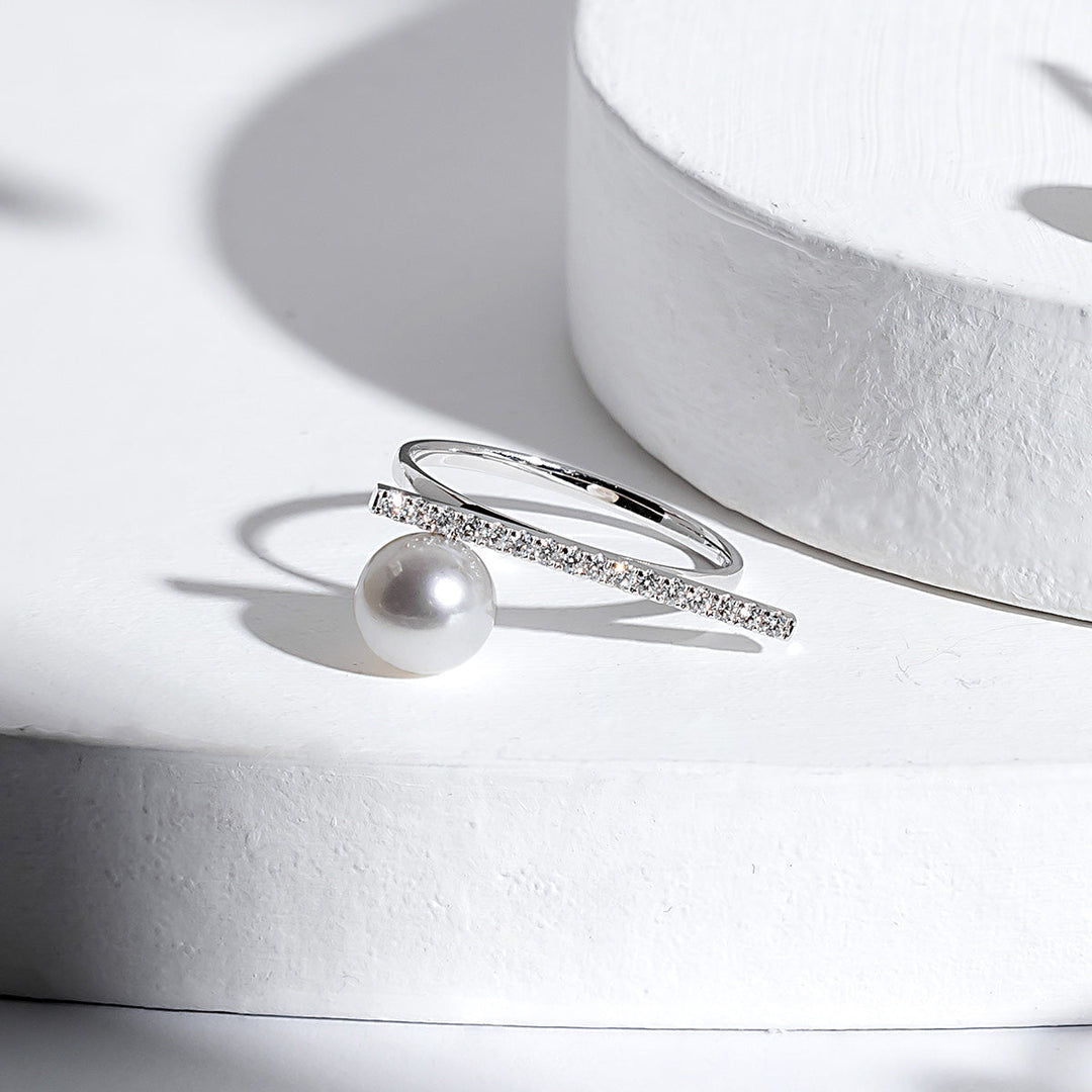 Akoya Pearl 18K white gold moon-shaped diamond ring from Reflection Collection, showcasing a luminous pearl and sparkling diamonds.