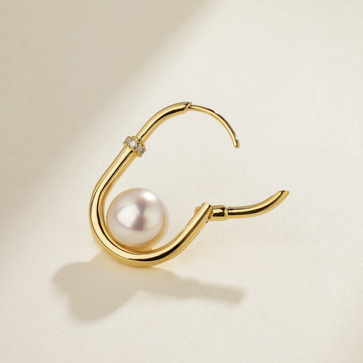 Side detail of freshwater pearl gold vermeil diamond hoop earring showing hinge clasp