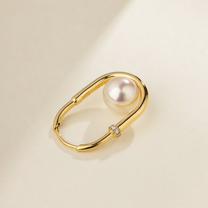 Close-up of freshwater pearl in gold vermeil U-shaped hoop earring with lab-grown diamond accent