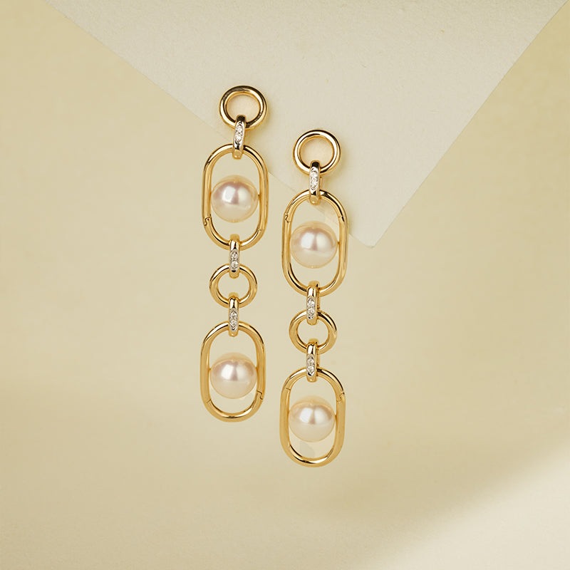 Gold vermeil double-link oval drop earrings with freshwater AAAAA pearls, long style, flat lay