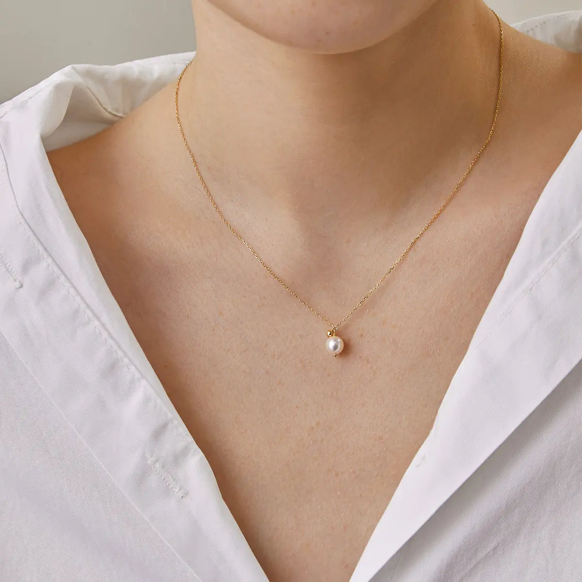 Akoya pearl 18K gold ball necklace from Star Trails Collection, featuring a elegant string of lustrous pearls with gold accents.