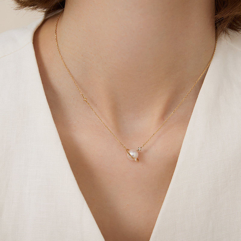 Saltwater Pearl 18K gold and diamond planet necklace from Star Trails Collection with a delicate chain and celestial pendant.
