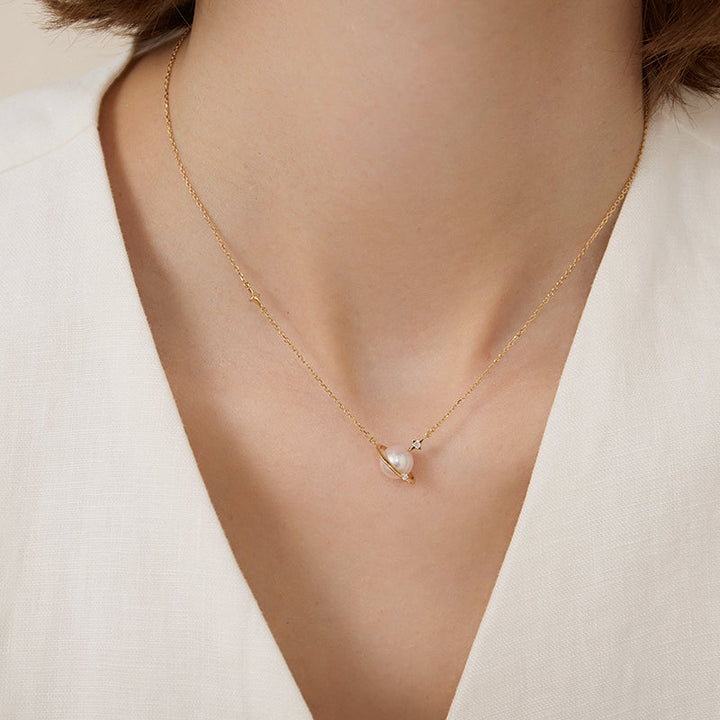 Saltwater Pearl 18K gold and diamond planet necklace from Star Trails Collection with a delicate chain and celestial pendant.