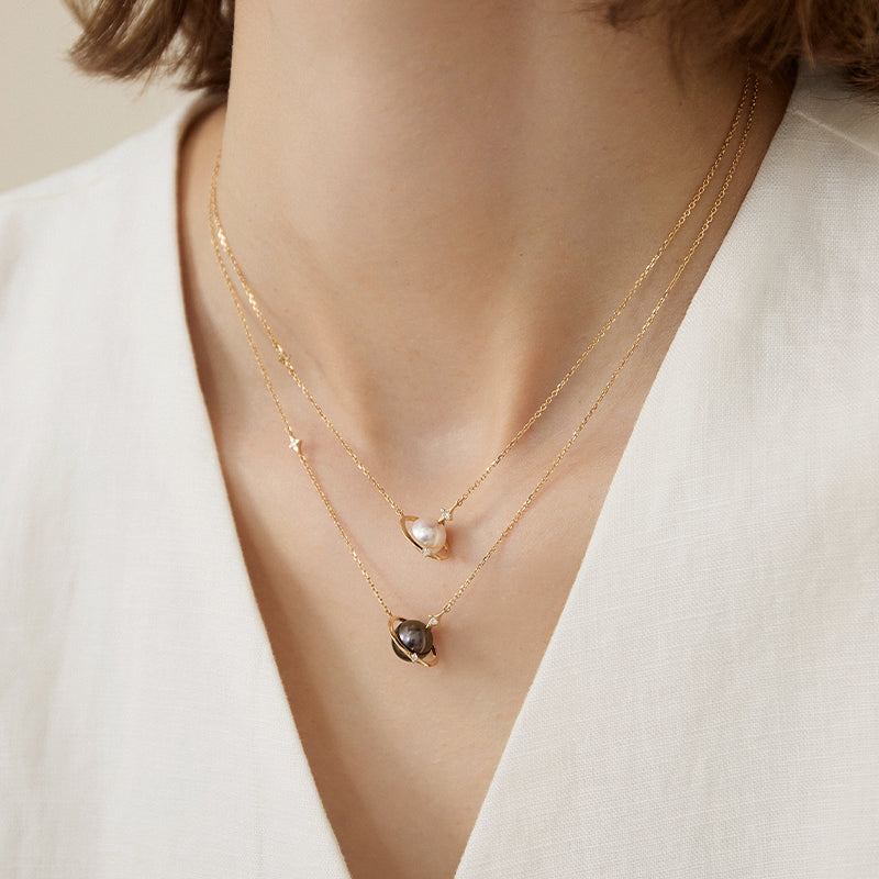 Saltwater Pearl and diamond planet necklace in 18K gold from Star Trails Collection, featuring a celestial-inspired design.