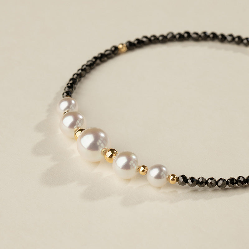 AAAAA freshwater pearls in graduating sizes with gold vermeil beads and black spinel, smile design detail