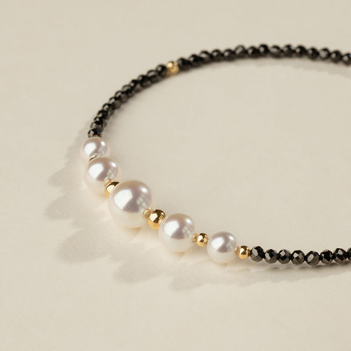 AAAAA freshwater pearls in graduating sizes with gold vermeil beads and black spinel, smile design detail