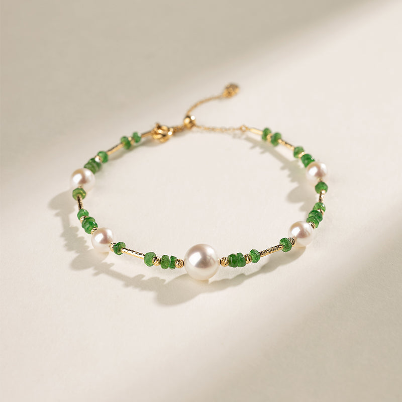 Gold vermeil freshwater pearl and tsavorite baby's breath bracelet, flat lay