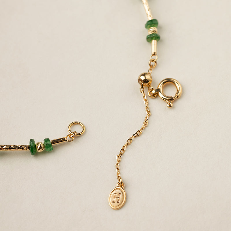 Gold vermeil spring ring clasp and adjustable extension chain with HELAS logo charm, bracelet detail
