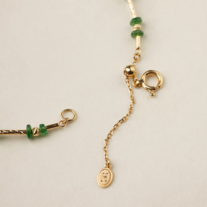 Gold vermeil spring ring clasp and adjustable extension chain with HELAS logo charm, bracelet detail