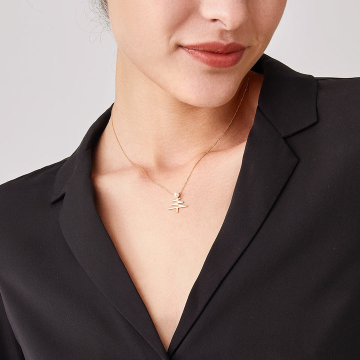 Akoya pearl 18k yellow gold Christmas tree necklace from Wish Collection featuring a delicate pearl-adorned holiday design.