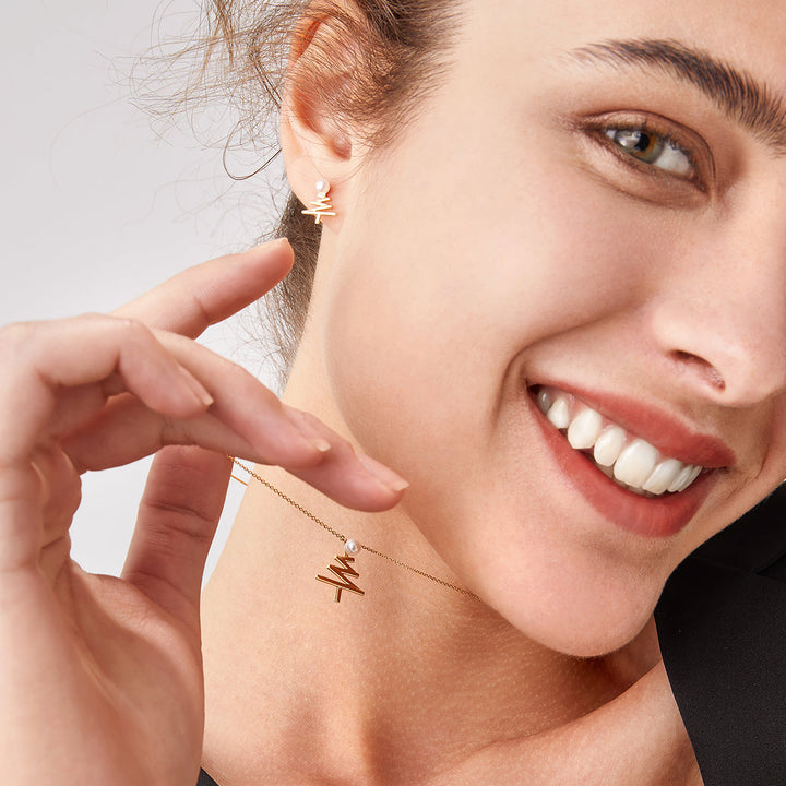 Akoya pearl Christmas tree necklace with 18k yellow gold from Wish Collection, featuring a delicate holiday-themed jewelry design.