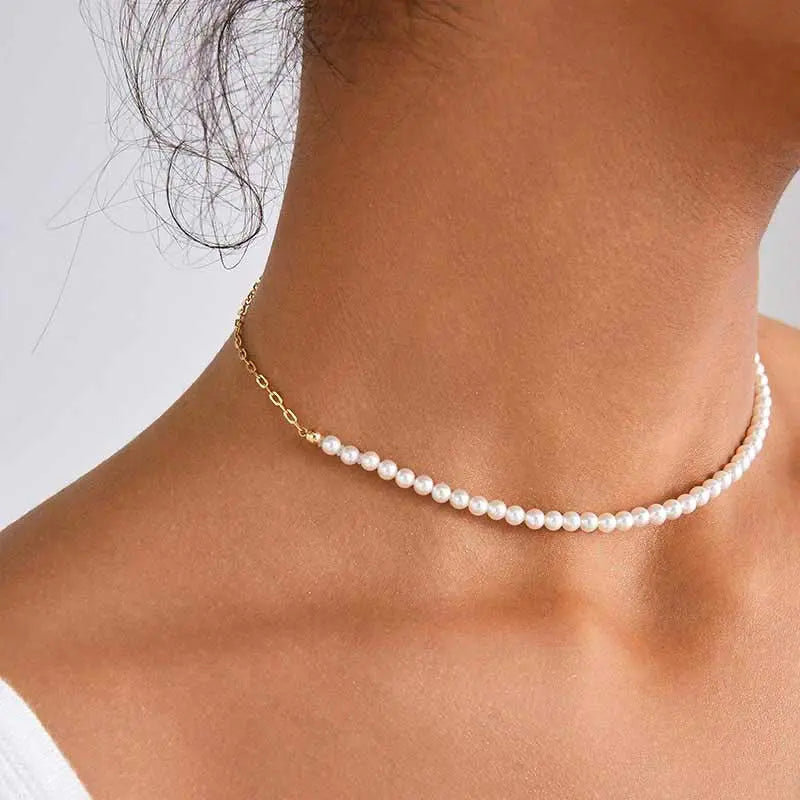 Model wearing freshwater pearl gold vermeil half chain necklace, front neck view