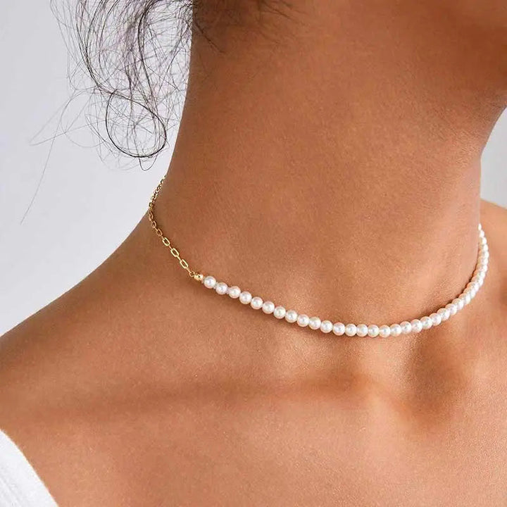 Model wearing freshwater pearl gold vermeil half chain necklace, front neck view