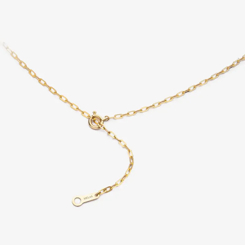 Close-up of gold vermeil spring ring clasp and HELAS logo tag on sterling silver chain
